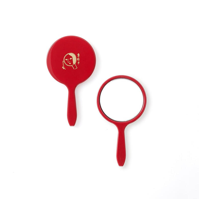 A pack of oil-blotting facial papers and a round hand mirror (red)